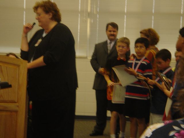 Plaque, certificate, and medal