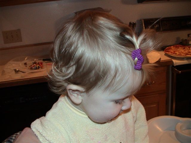 Figured out how to stand up in her high chair